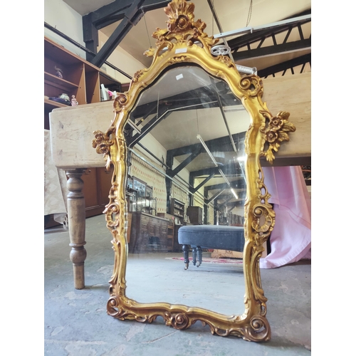 17 - Beautifully decorative and tall wall hanging mirror with an ornate golden frame