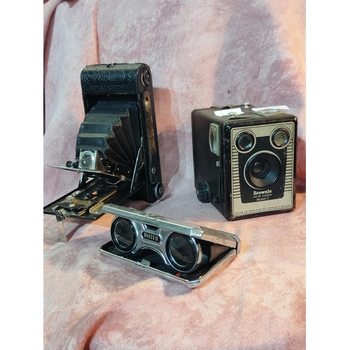 53 - A fine collection of 2 vintage cameras, a Box Brownie and an Ensign bellows, together with very clev... 