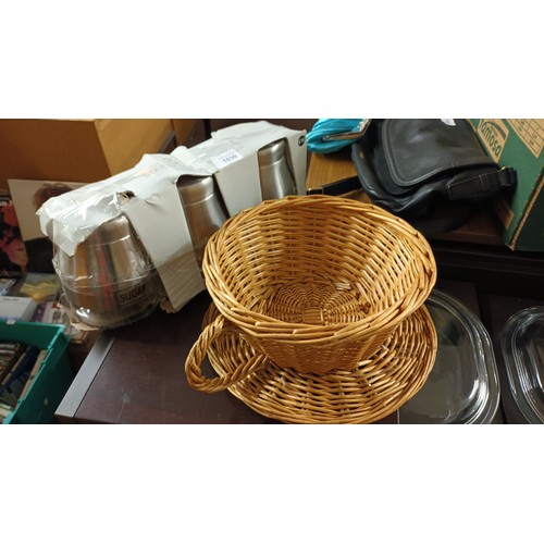 1030 - Set of 3 stainless steel storage jars together with a cute wicker teacup and saucer shaped basket