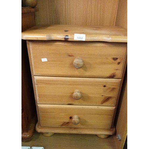 1092 - Stylish 3 drawer pine bedside unit, perfect for most types of decor