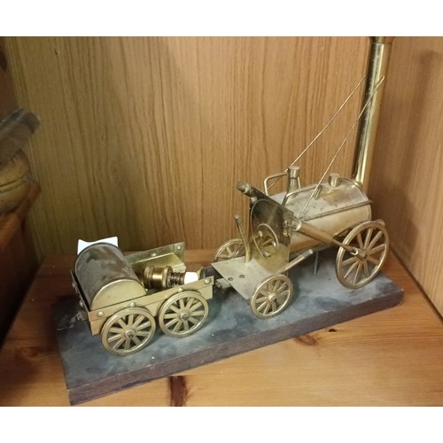 1093 - Fabulous brass model of Stephenson's rocket on a wooden plinth, approx 33cm long