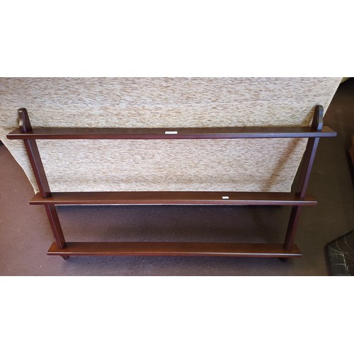 1127 - 3 shelf wooden display unit approx 105cm wide, 60cm high and a max of 7cm deep