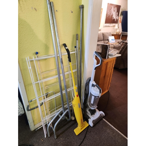 1172 - Bissell lightweight vacuum cleaner together with clothes airer and metal clothes rail.