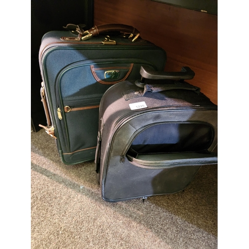 1220 - Two compact cabin sized suitcases, one a dark green Antler and the other black