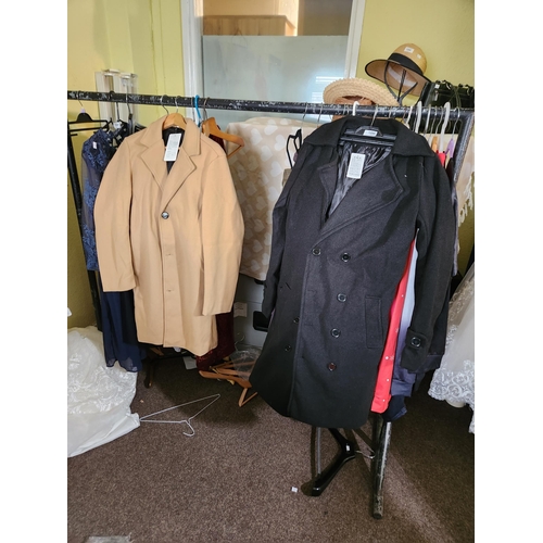 1250 - Lovely long black coat with back button fastening detail. It says 3XL but the chest measurement is a... 