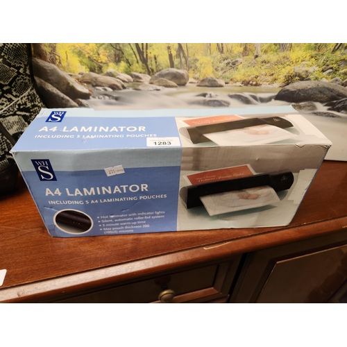 1283 - Brand new in box WH Smith A4 laminator with laminating pouches