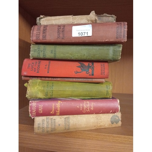 1071 - A selection of vintage hardback books including Bulldog Drummond and P.G. Wodehouse