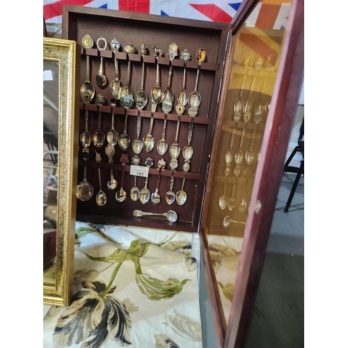 141 - Lovely display cabinet full of decorative teaspoons