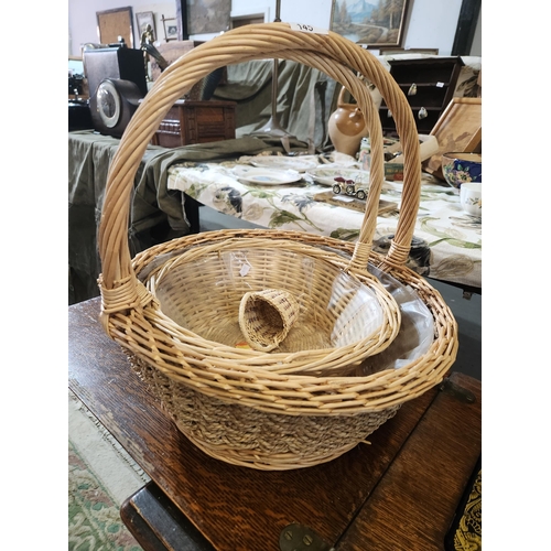 145 - Lovely selection of 3 wicker baskets with handles in 3 different sizes