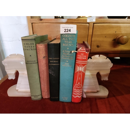 224 - 2 beautiful onyx horse's head bookends together with a selection of vintage hard back books