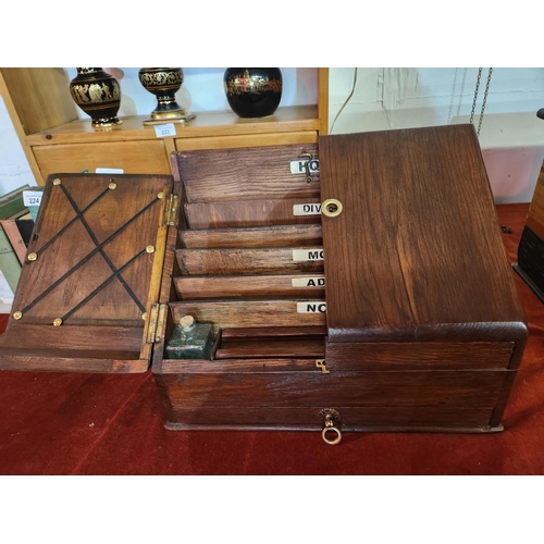 225 - Fabulous Victorian open out stationary box with 2 ink bottles, pen storage, divided sections and a d... 