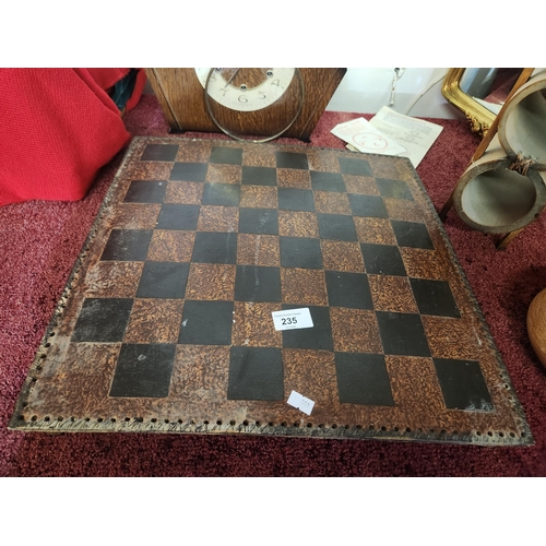 235 - Embossed leather chessboard with a bound edge