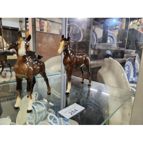 284 - Lovely ceramic model of a brown horse and foal