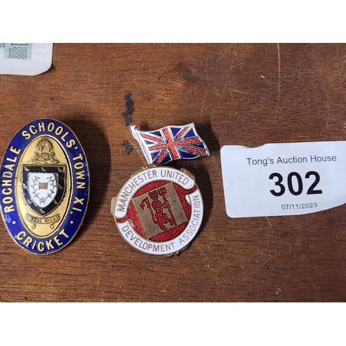 302 - A Rochdale school cricket badge, a Manchester United Development badge and a small Union Jack pin