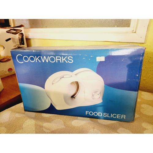 12 - BRAND NEW COOKWORKS FOOD SLICER IN BOX.