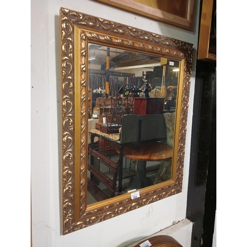 204 - Lovely wall hanging mirror with ornate gold painted frame. 54 x 64cm