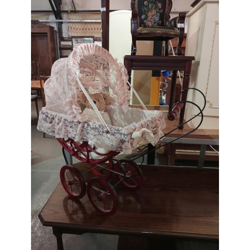 262 - A lovely lace covered vintage dolls pram complete with teddy in gorgeous silk gown