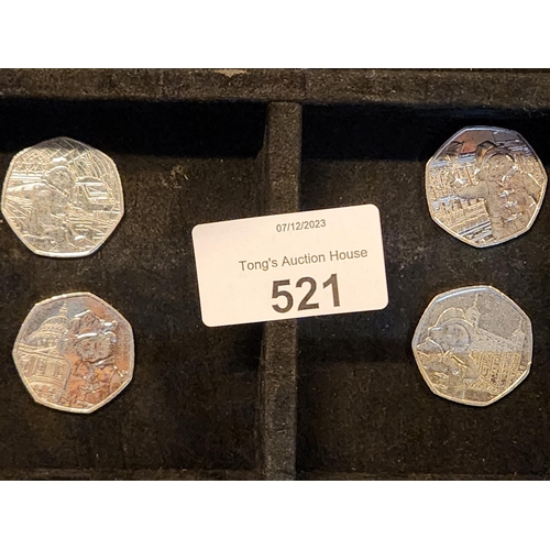 521 - collection of 4 paddington bear 50 Pence pieces