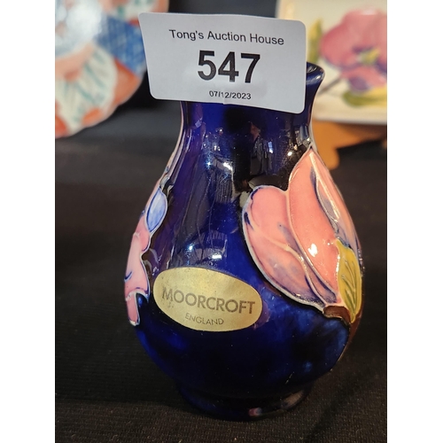 547 - Small Blue Hibiscus bud vase with Moorcroft label