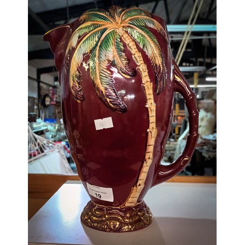 19 - Fun and quirky Beswick rouge gilt Palm tree jug standing approx 11