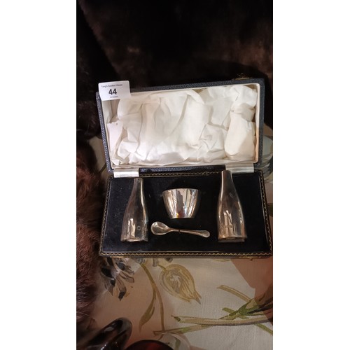 44 - Silver cruet set, Birmingham 1960 in the form of champagne bottles and a wine cooler