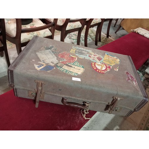 51A - Vintage well travelled suitcase.
