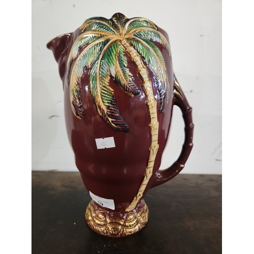 19 - Fun and quirky Beswick rouge gilt Palm tree jug standing approx 11