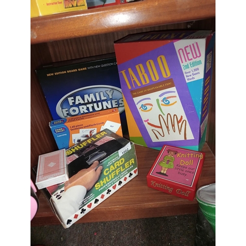 1002 - Bundle of boxed games including Family Fortunes, Taboo, a card shuffler and more