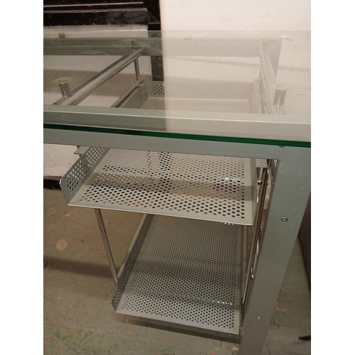 1050 - HIGH QUALITY MODERN DESIGNER STYLE GLASS AND CROME DESK WITH PULL OUT SHELVES. APPROX 150 W X 75 H X... 