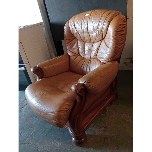 1445 - QUALITY TAN LEATHER ARMCHAIR WITH SOLID WOODEN SCROLL FRAME IN GREAT CONDITION