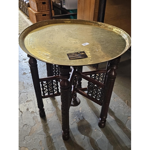 180 - Fabulous 6 legged wooden table with large detachable brass tray top which is approx 59cm in diameter