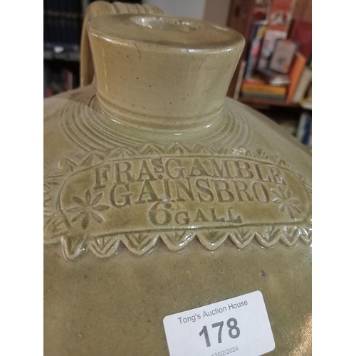 178 - Very large earthenware bottle standing approx 58cm tall.