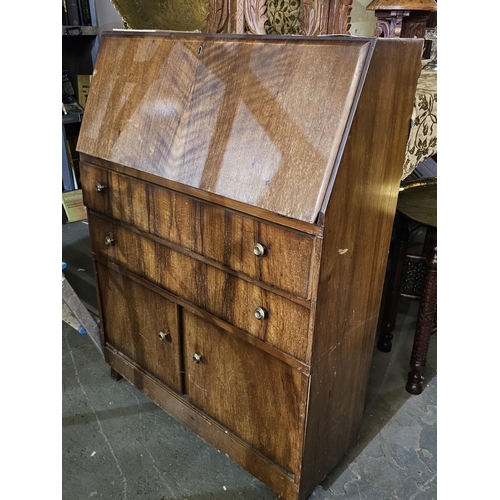 175 - Vintage bureau with pull down writing surface exposing pigeon holes. It has 2 full width drawers ove... 
