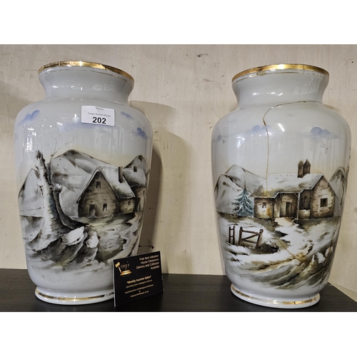202 - 2 lovely vases depicting winter countryside scenes. One has restoration
