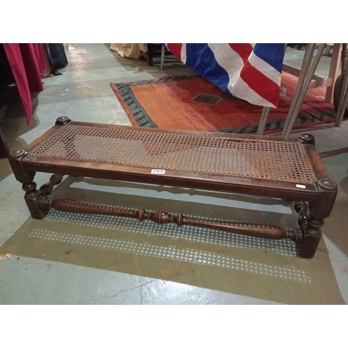 291A - Antique oak rattan long bench with beautiful turned wood detail. 92cm length x 25cm height.
