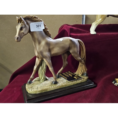 301 - figure of a horse on a wooden plinth