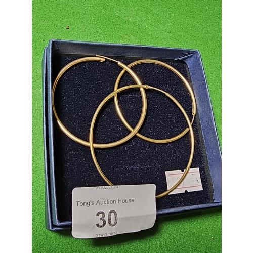 30 - Pair 375 gold hoop earrings measuring 5cm across plus one measuring 6cm