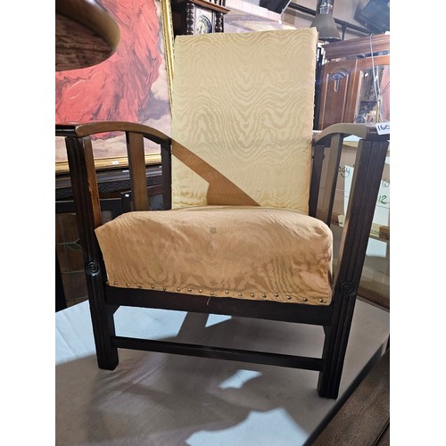 160A - Upholstered fireside chair with carved wood accents