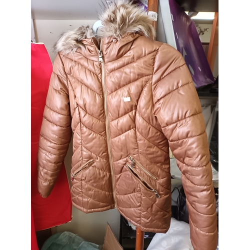 531 - 2 good condition winter Coats. One a brown ladies coat from F and F in size 10. The other a green an... 