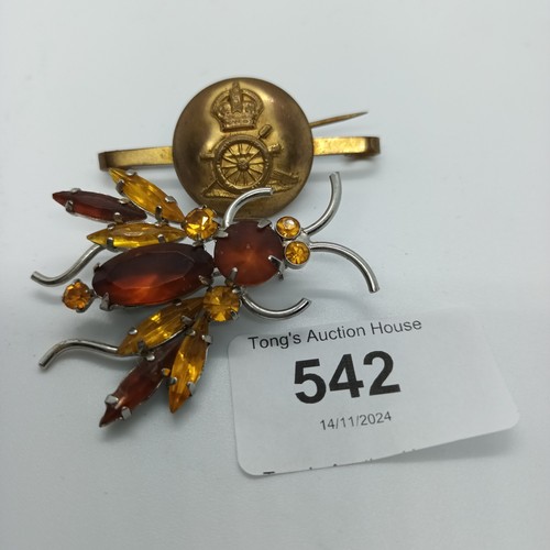 542 - Bug brooch and military button brooch