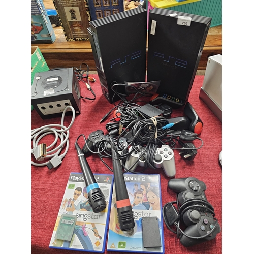 266 - 2 x PS2, adaptors, controllers, accessories, cables and games