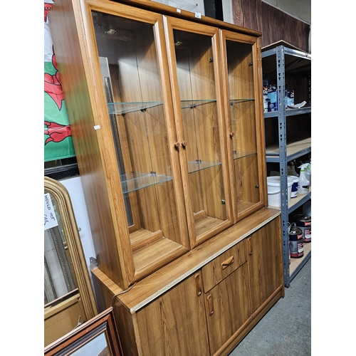 518 - Retro display unit with 3 glass fronted cabinets over 3 cupboards with a central drawer