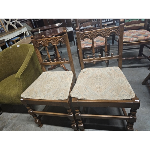 1002 - Pair of  Ercol carved back dining chairs