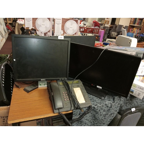 1197 - A pair of computer monitors, Dell and LG together with a switchboard telephone