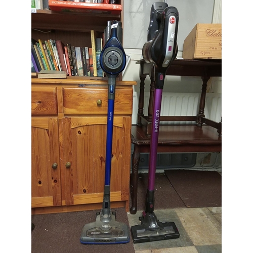 1212 - Pair of cordless upright vacuum cleaners, Hoover and Beldray