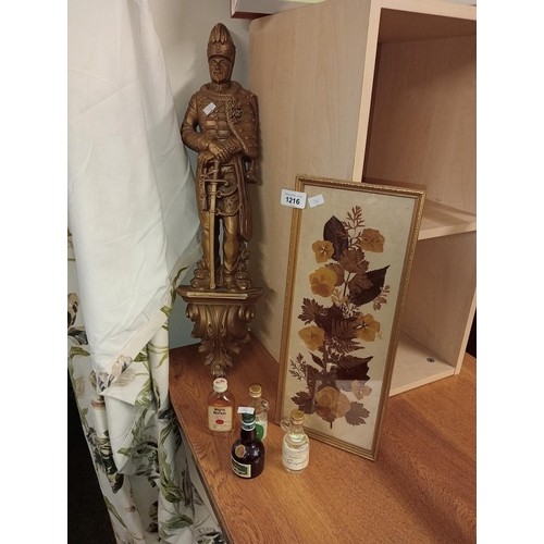 1216 - Figure of a military man on a plinth together with 4 miniature spirit bottles and a leaf collage pri... 