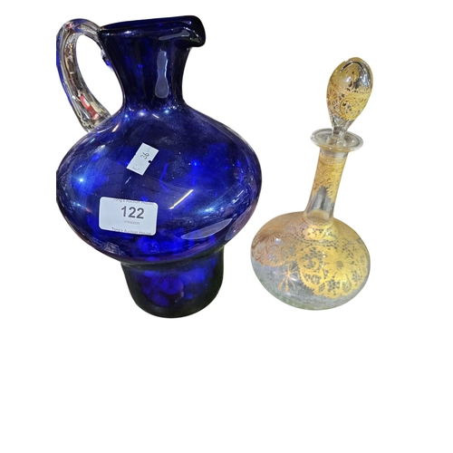 122 - Heavy blue glass jug with clear glass handle together with decorative Italian glass bottle with stop... 