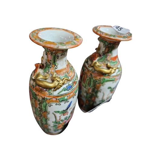 145 - Pair of Chinese handpainted vases, standing approx 16cm tall