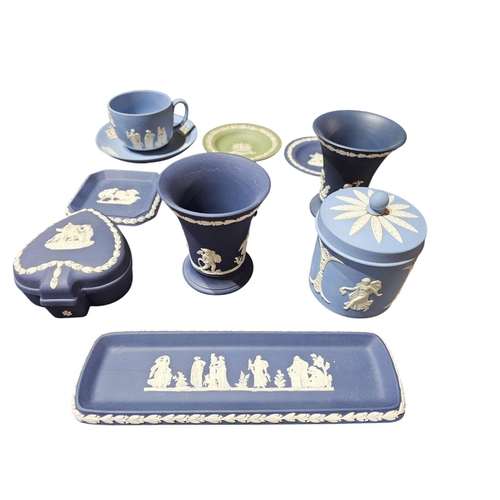 84 - Very large collection of blue and white Jasperware from Wedgwood together with a green and white dis... 