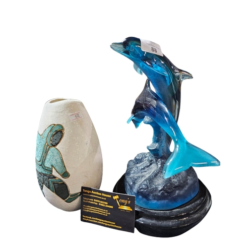 88 - Resin model of dolphins together with a ceramic vase with a dancing figure